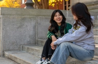 Two women sitting on the steps of the Liberal Arts Center. January: Know Yourself, Your Priorities, and Your Career Interests Discover the Power of Mentorship and Career Assessments