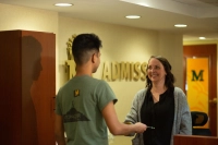 A Marywood admissions counselor greets a prospective student. How to Transfer from a Closing College