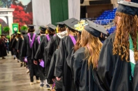 Graduates in academic attire lined up to receive their degrees. Marywood University Celebrates 107th Annual Commencement Ceremony