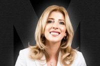 Blonde woman smiling, wearing a white suit agains a black background, with an M logo shaded in the background. President Lisa A. Lori, J.D. Recognized as a 2025 Chambers USA Ranked Lawyer