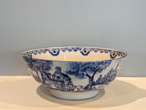 White and blue bowl depicting a colonial pastoral scene