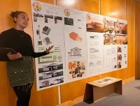 girl presenting work displayed on wall Pennsylvania’s Interior Designers Pass Historic Legislation Elevating Marywood University’s Leadership in the Field