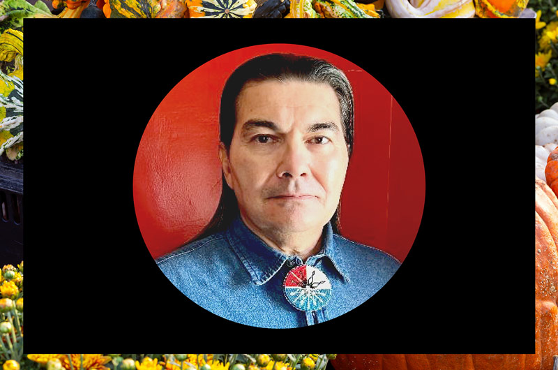 Man with dark hair in a denim shirt against a red background on top of a black square Lenape/Delaware Leader Curtis Zunigha to Speak at Marywood on October 6