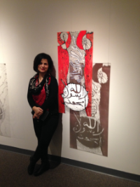 Poshya Kakil Ahmed stands next to her exhibit at the University Architecture Graduate Named Finalist in an International Art Competition