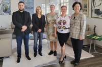 A group of visiting faculty from Romania joined President Lisa Lori in her office, along with Sister Angela Kim, IHM. International Faculty Visit MSW program, Participate in Inauguration Events