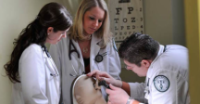 three physician assistant students examine dummy Physician Assistant Program Among Top 15 in Pennsylvania