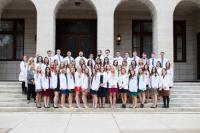 Physician Assistant students accept their first white coat. PA Students Receive White Coats at Ceremony