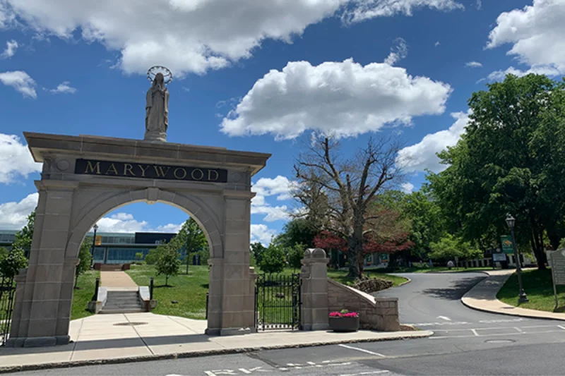 St. Mary's arch at the front of campus with Her on top and 